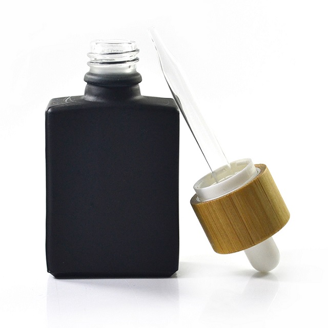Glass dropper bottle with bamboo lid