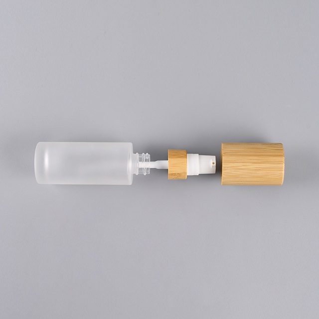 Luxury 30ml 50ml 100ml Empty Skincare Lotion Cream Glass Spray Round Frosted clear Cosmetic Bottle Packaging with bamboo Pump lid