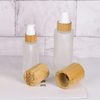 Luxury 30ml 50ml 100ml Empty Skincare Lotion Cream Glass Spray Round Frosted clear Cosmetic Bottle Packaging with bamboo Pump lid