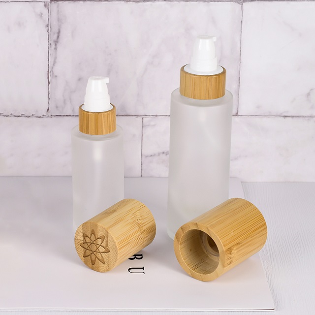 Luxury 30ml 50ml 100ml Empty Skincare Lotion Cream Glass Spray Round Frosted clear Cosmetic Bottle Packaging with bamboo Pump lid