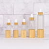 Luxury 30ml 50ml 100ml Empty Skincare Lotion Cream Glass Spray Round Frosted clear Cosmetic Bottle Packaging with bamboo Pump lid