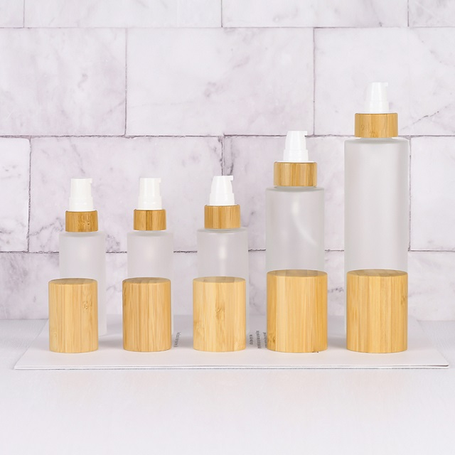 Luxury 30ml 50ml 100ml Empty Skincare Lotion Cream Glass Spray Round Frosted clear Cosmetic Bottle Packaging with bamboo Pump lid