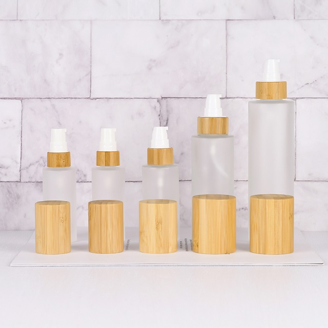 Luxury 30ml 50ml 100ml Empty Skincare Lotion Cream Glass Spray Round Frosted clear Cosmetic Bottle Packaging with bamboo Pump lid