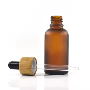 Frasco cuentagotas de vidrio para aceites esenciales con tapa de bamb&uacute;