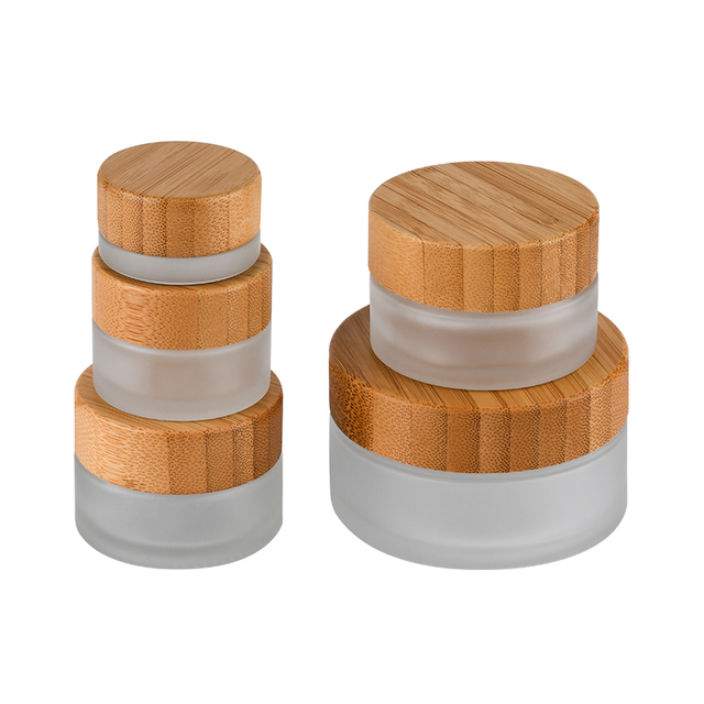 Hot sale cosmetic face cream container 5ml 15ml 30ml 50ml 100ml frosted clear glass jar with bamboo wood lid