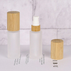 Luxury 30ml 50ml 100ml Empty Skincare Lotion Cream Glass Spray Round Frosted clear Cosmetic Bottle Packaging with bamboo Pump lid