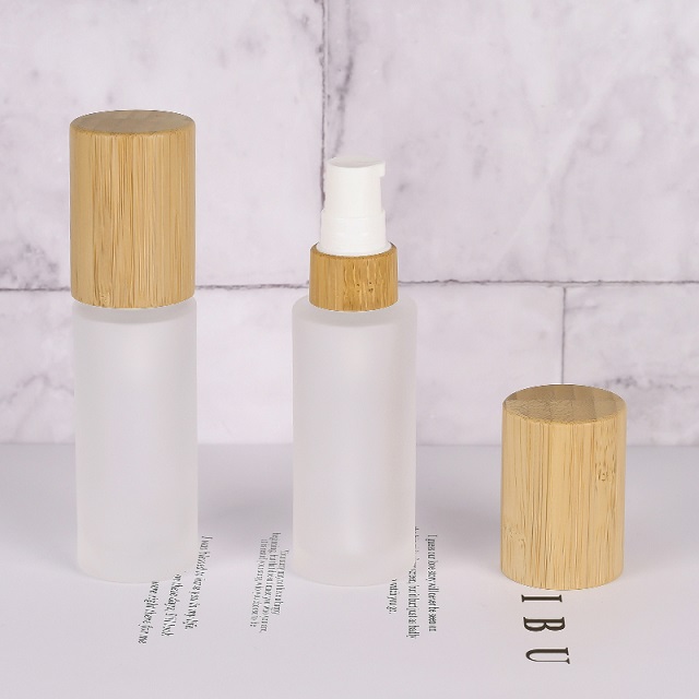 Luxury 30ml 50ml 100ml Empty Skincare Lotion Cream Glass Spray Round Frosted clear Cosmetic Bottle Packaging with bamboo Pump lid