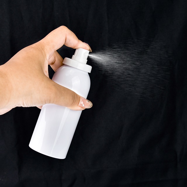 Aerosol spray bottle with dome cap