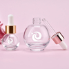 Popular 15ml 20ml 30ml aceite para el cabello aceite de aromaterapia aceite esencial suero botella cuentagotas de vidrio con tapa de rosa dorada y plateada