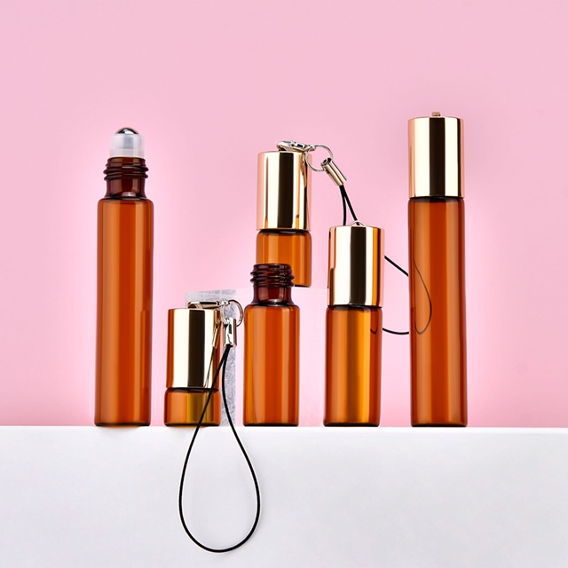 5ml Amber Glass Rollerball Bottle with Custom Logo & Keychain Travel Size Essential Oil Perfume Sample Bottle for OEM/ODM