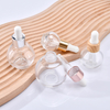 Popular 15ml 20ml 30ml aceite para el cabello aceite de aromaterapia aceite esencial suero botella cuentagotas de vidrio con tapa de rosa dorada y plateada