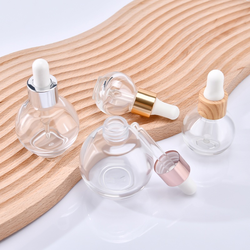 Popular 15ml 20ml 30ml aceite para el cabello aceite de aromaterapia aceite esencial suero botella cuentagotas de vidrio con tapa de rosa dorada y plateada